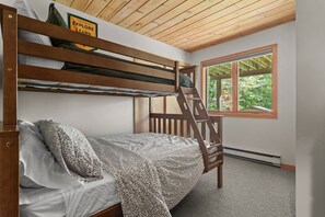 A bunk bed with a ladder, a window with a view of greenery, and a sign above the bed. - Modern Alpine Chalet 2 Miles from Belleayre (Pine Hill)