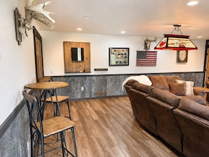 Dartboard and bar seating gives your group even more room to spread out, relax, enjoy drinks, watch TV, and spend quality time together during your stay. - State ATV Trail|Updated|Wildlife|Trailer Parking (Birchwood)