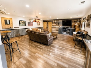 Back inside, step into the inviting living room just off the kitchen. The open, easy-flow layout keeps everyone connected, with plenty of space for your group to relax, gather, and enjoy time together. - State ATV Trail|Updated|Wildlife|Trailer Parking (Birchwood)
