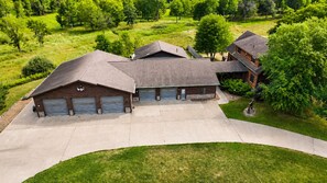 Aerial view of the property entrance, buildings, driveway, and parking area, showing the generous space available for larger groups traveling with multiple vehicles and outdoor gear. - Two Homes · Private Pond & ATV Trails · Sleeps 24 (Birchwood)