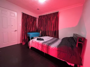 A bedroom with a bed, a desk, and curtains. - Two Bedroom Apartment, Main Fl, 20 mins from Downtown Toronto (Toronto)