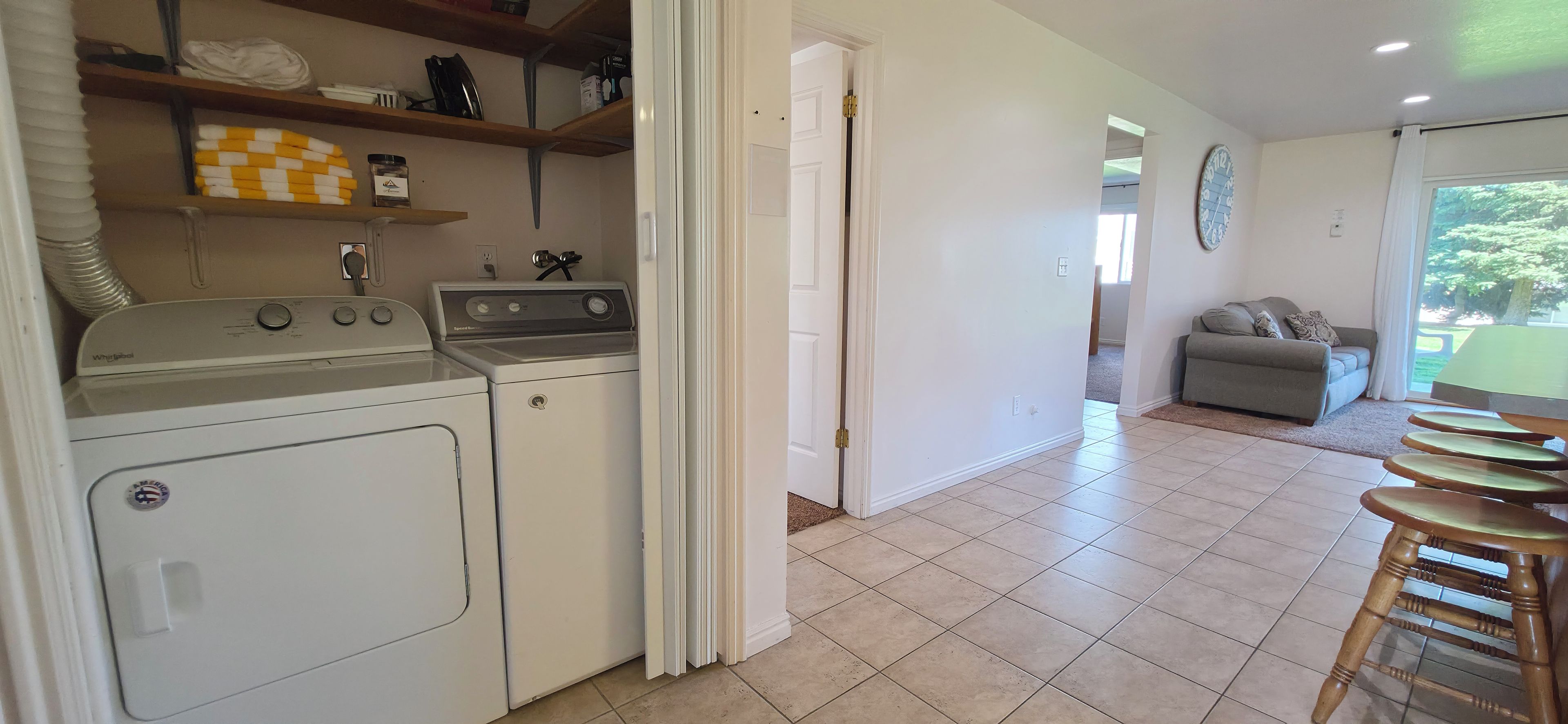 Convenient in-home washer/dryer beside a bright, open living space