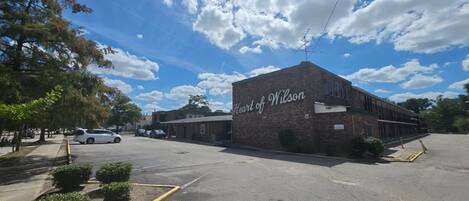 A parking lot with a building labeled 'Heart of Wilson'.