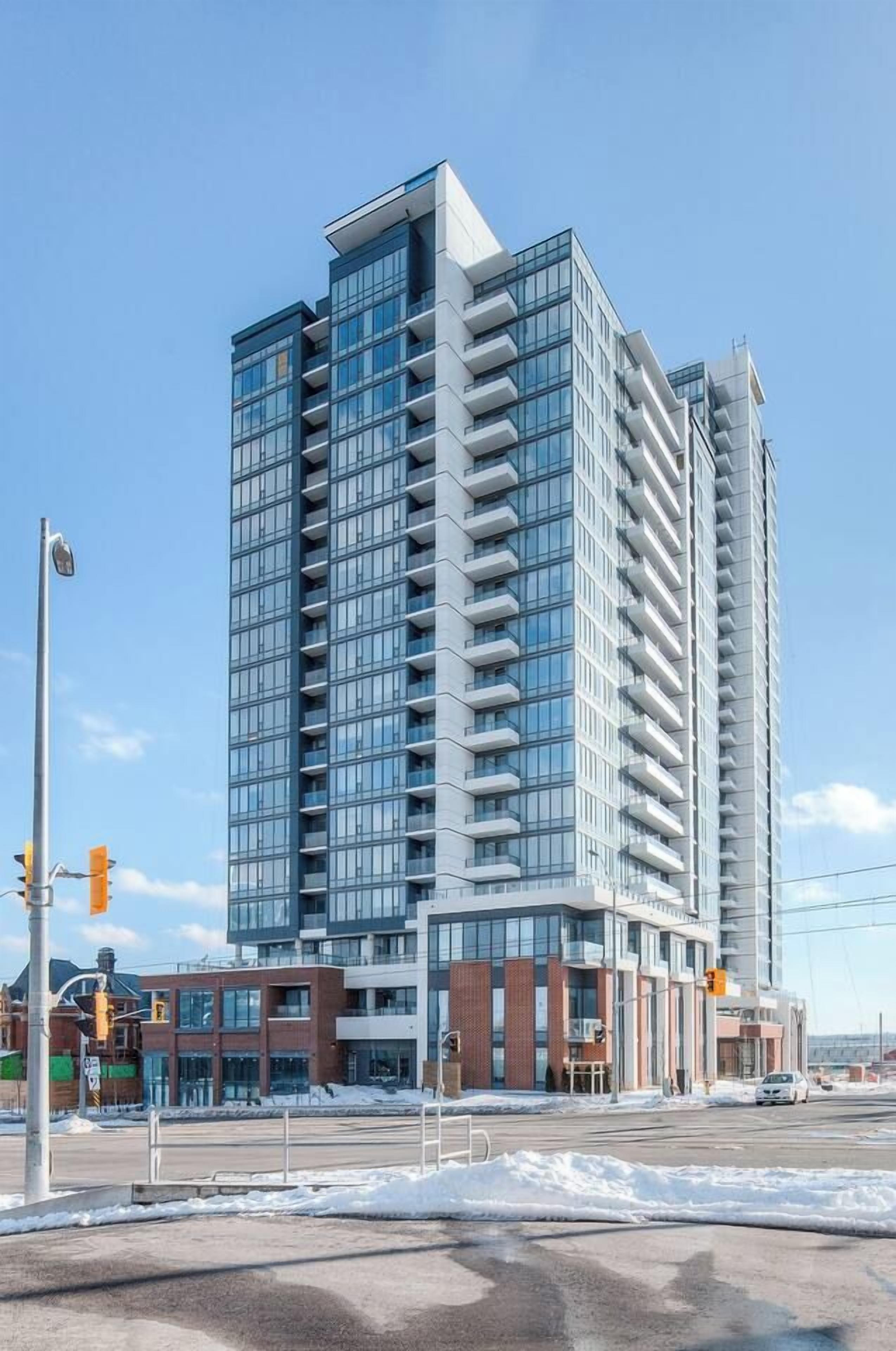 A high-rise building with multiple floors, large windows, and a modern architectural design.