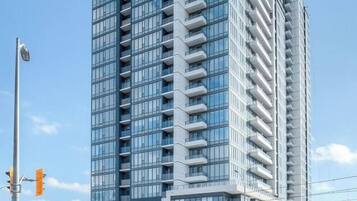 A high-rise building with multiple floors, large windows, and a modern architectural design.