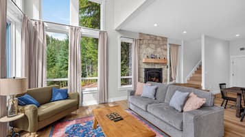The couch in this open and view-filled room is a sleeper for 2 adults.
