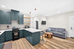 This comfy sofa is a sleeper for up to 2 adults. - Private Hot Spring | Views | River | Brundage (New Meadows)