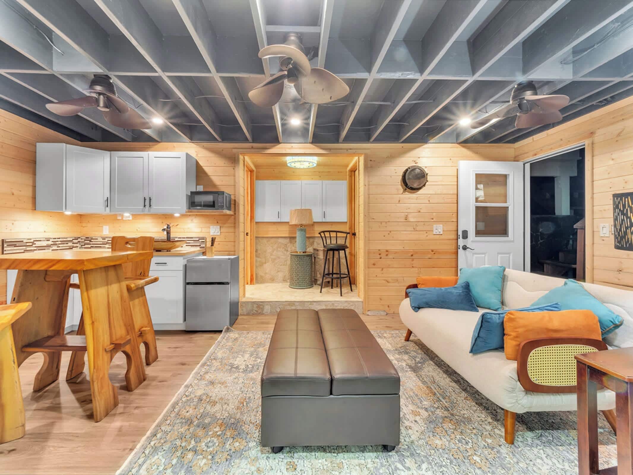 A compact living space with a kitchen, dining area, and seating area.