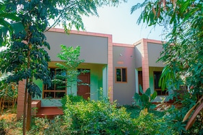 A building with a flat roof, large windows, and a door.