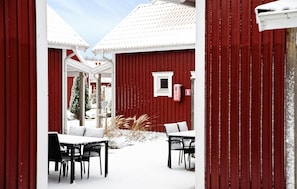 A red barn with a white door, a small window, and a mailbox. - Gorgeous home in Varberg with heated swimming pool (Varberg)