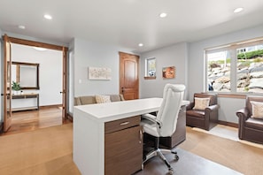 A modern office space with a desk, office chair, and two leather armchairs. - Summit & Slide Adventure Lodge (Heber City)