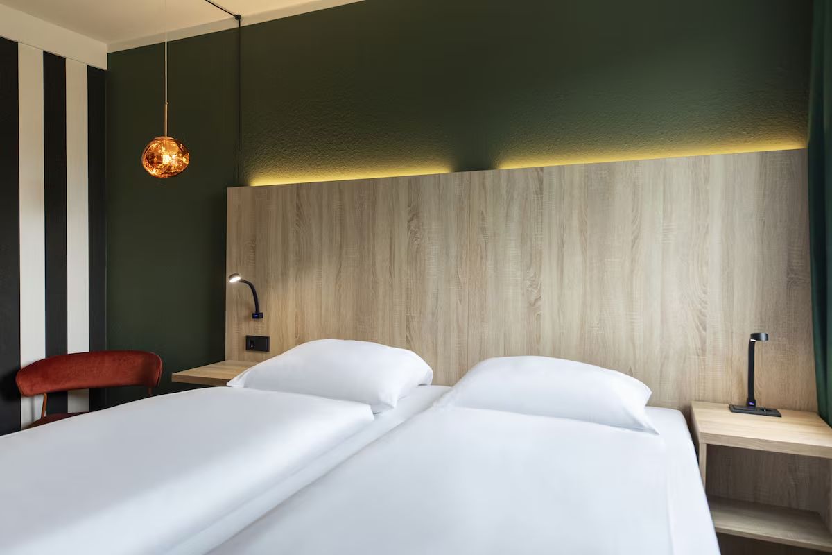 Stretch out and relax with extra-wide headboard and bedside shelves.