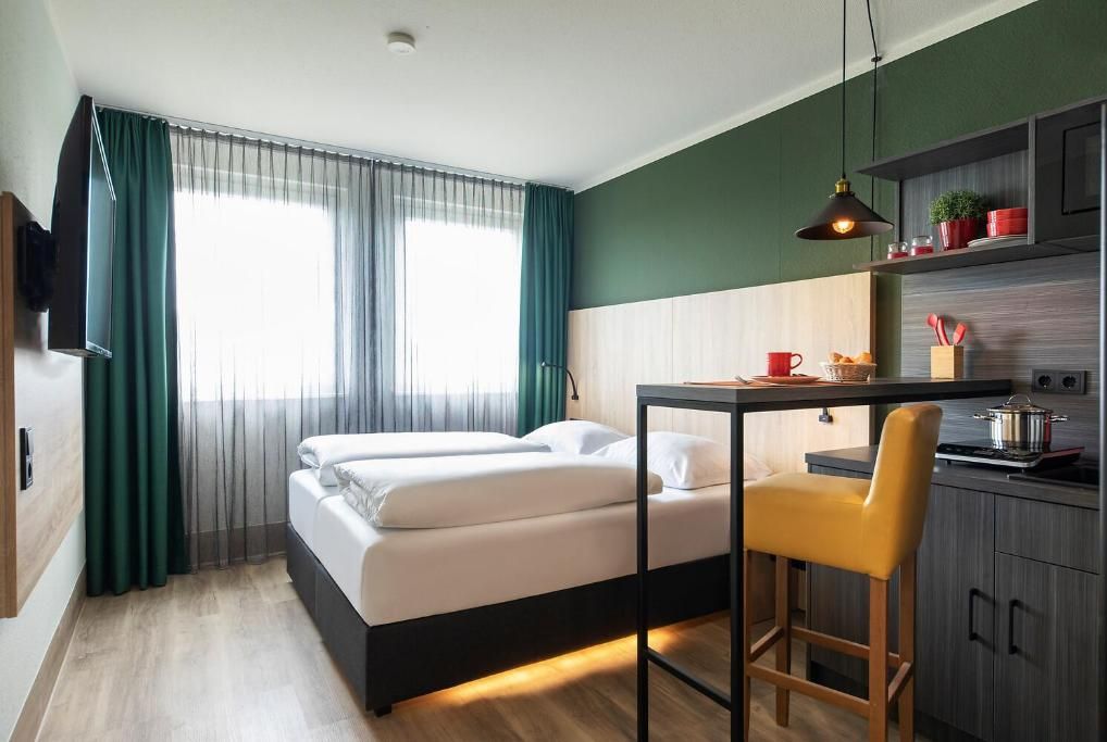 Wake up to soft daylight in a bright, modern studio.