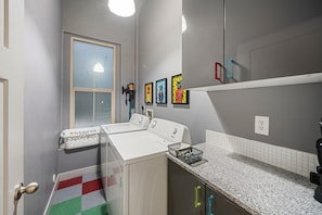 Dedicated laundry room with a full-size washer and dryer.