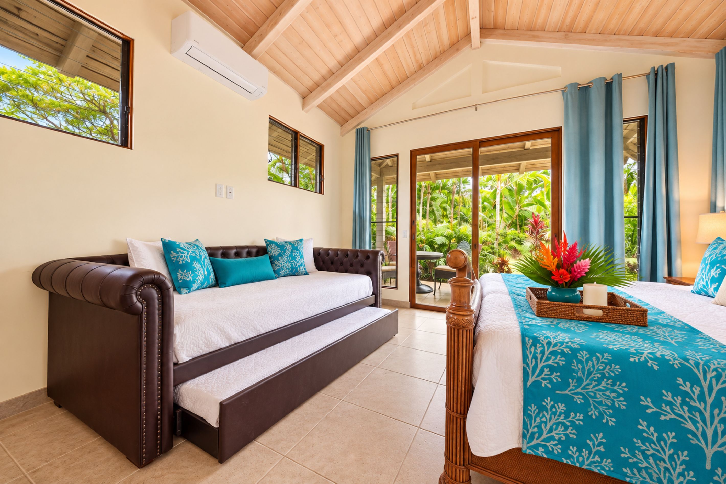 A bedroom with a sofa bed, a separate bed, a window with curtains, and a view of greenery outside.