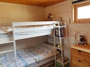 A bunk bed room with a ladder, a small desk, and a window. - Chalet in Praz-de-Fort im Val Ferret by Interhome (Champex)