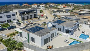 Aerial view highlighting the full property footprint, private layout, and serene surrounding neighborhood. - Brand New 3BR Villa | Pool, BBQ & Lighthouse View (Noord)
