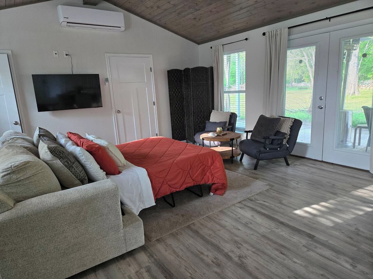 Comfortable sleeping area within the open layout.
