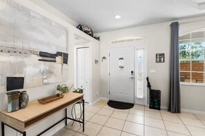 Bright, stylish entryway with natural light and modern decor - NEW! Heated Pool, Fire Pit, Near Beaches, Dining (Palm Coast)