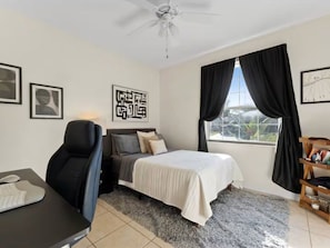 Bright modern bedroom with workspace, natural light, and cozy touches - NEW! Heated Pool, Fire Pit, Near Beaches, Dining (Palm Coast)