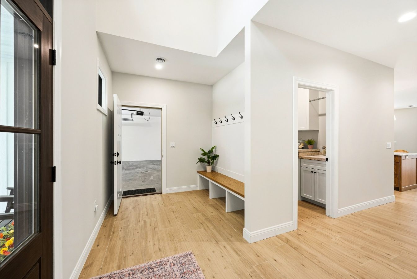 Open foyer leading to garage and laundry room.