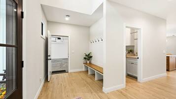 Open foyer leading to garage and laundry room.