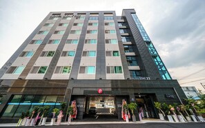A modern hotel building with a prominent 'HOTEL STAY 22' sign, a parking entrance, and a glass facade. - Stay 22 Hotel Daegu Innovation City (Daegu)