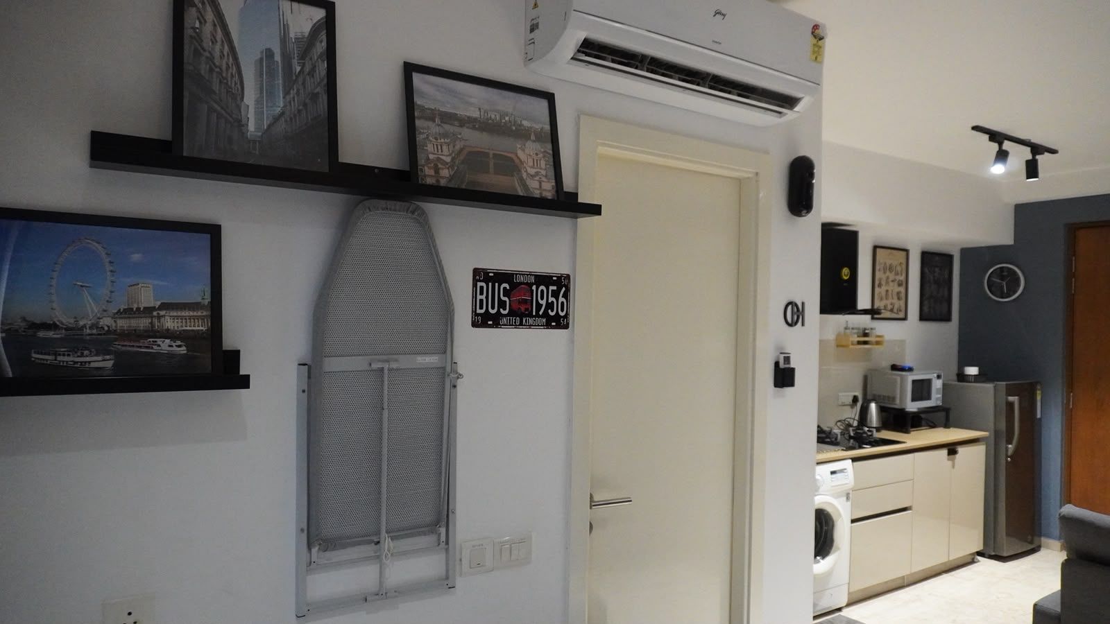A modern kitchen with a microwave, refrigerator, and sink.