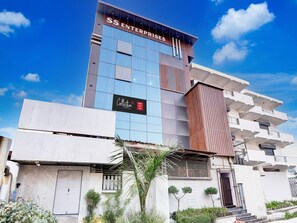 A hotel with a modern facade, a visible entrance, and a sign indicating it is a Collection Hotel Star Inn. - Collection O Hotel Star Inn (Ghaziabad)