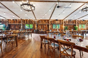 A spacious dining hall with wooden walls and tables set for dining. - Garden Views + Farm Breakfast + Frette | 1750 Inn | The Rose (Dover Plains)