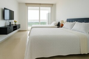 A bedroom with two beds, a TV, a nightstand, and a window. - Comfortable Apartment near the sea in Cartagena (Cartagena)