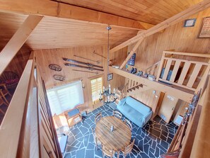 A wooden interior with a dining area, staircase, and ski equipment. - Chalet Pelou - 7 peoples - Morzine (Morzine)
