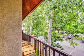 A balcony with a view of a street lined with trees and parked cars. - Walk to Ski Slopes! Sun Valley Condo w/ Balcony (Ketchum)