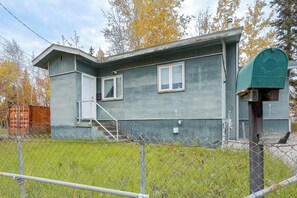 A single-story house with a front door, a small porch, and a mailbox. - Northern Lights Getaway: Fairbanks Home (Fairbanks)