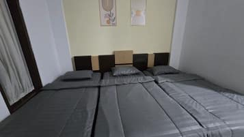 Una habitación con una cama grande, un cabecero de madera y dos obras de arte colgadas en la pared.