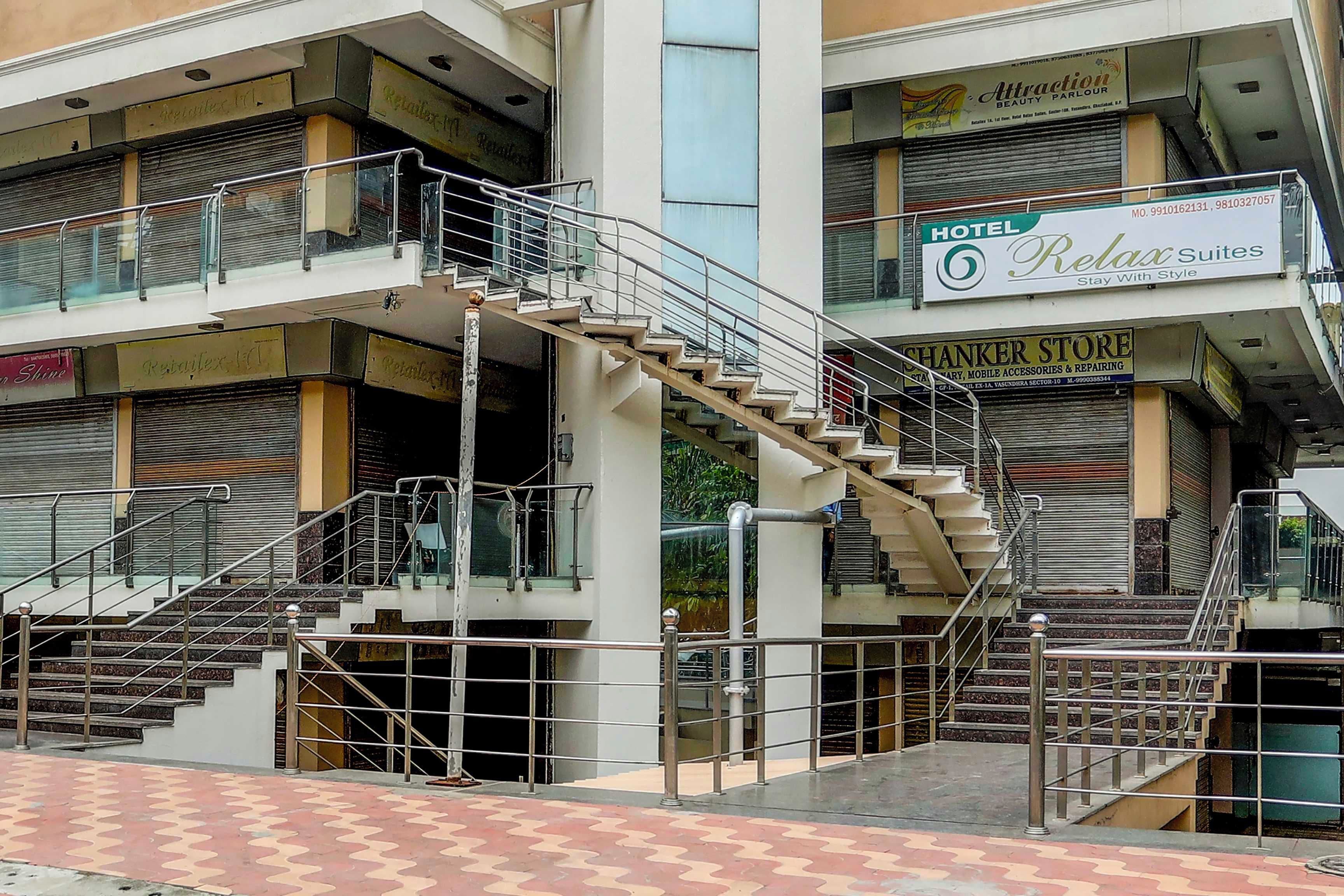 A multi-story building with a staircase connecting the floors.