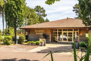 A reception building with a tiled roof and large windows.