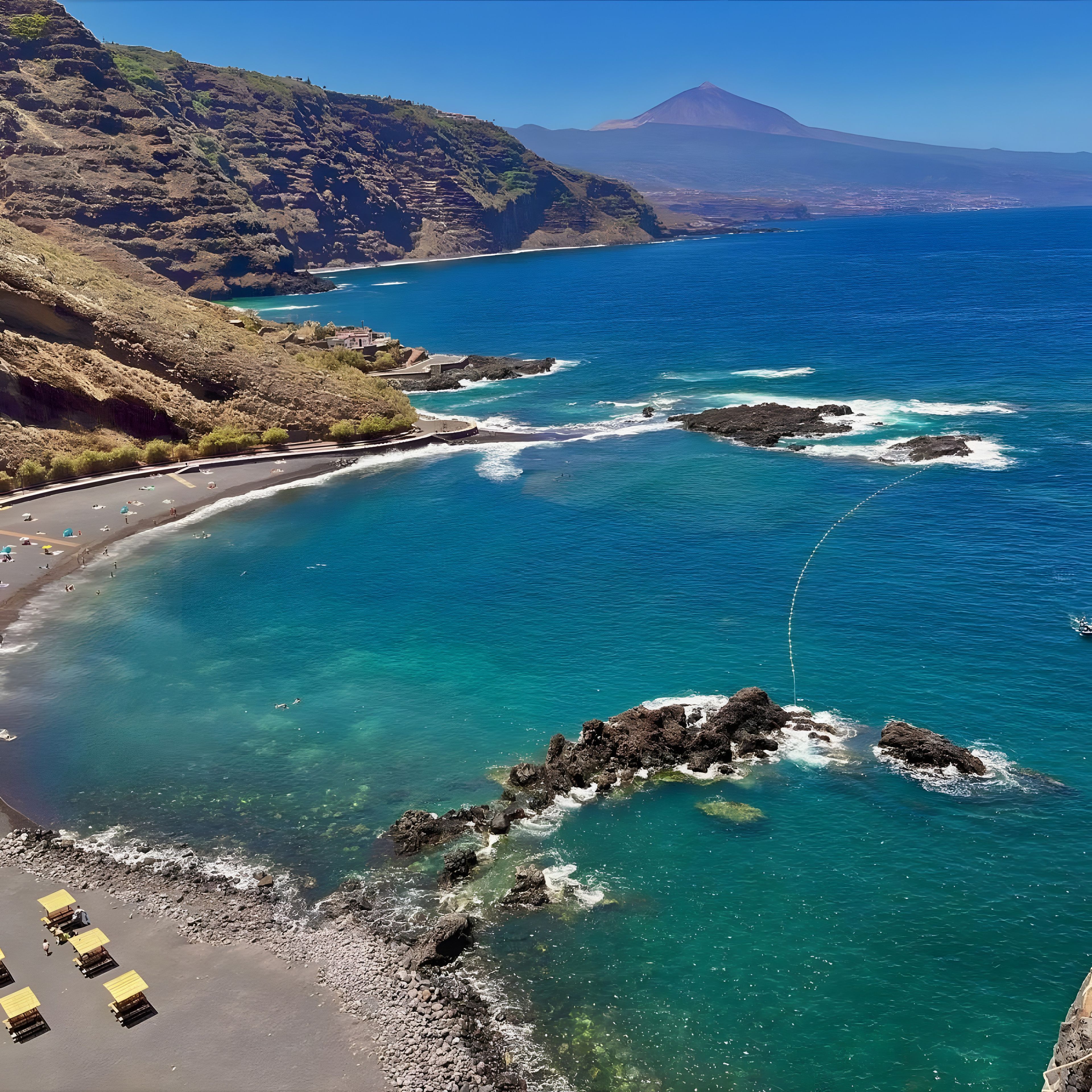 A coastal landscape with clear blue waters, rocky shores, and a mountainous backdrop.