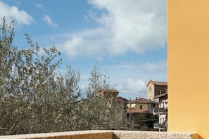 A view of a town with buildings and a clear sky. - Lake View Apt. w/ Wi-Fi & Parking in San Feliciano (San Feliciano)