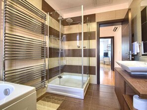 A modern bathroom with a glass-enclosed shower, a bathtub, and a vanity with a mirror. - Villa Magnifica With Private Pool in Pula (Pula)