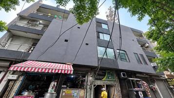 A multi-story building with a storefront at the ground level.
