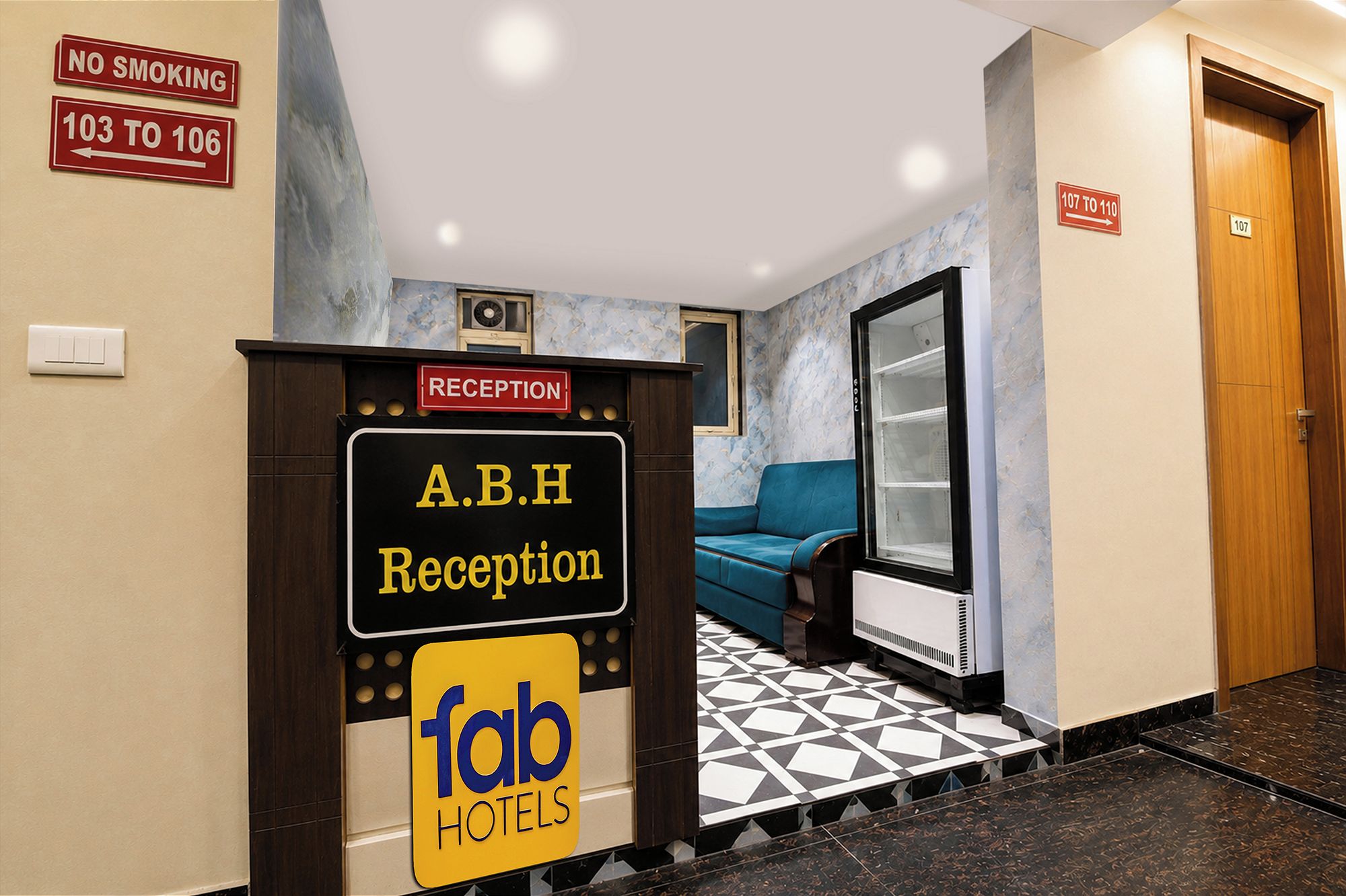 A reception area with a sign for A.B.H Reception and a 'fab hotels' logo.