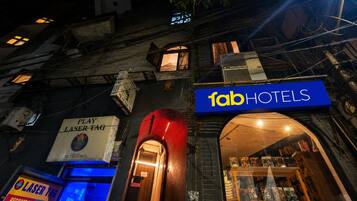 A building with a sign for 'fabHOTELS' and a visible entrance.