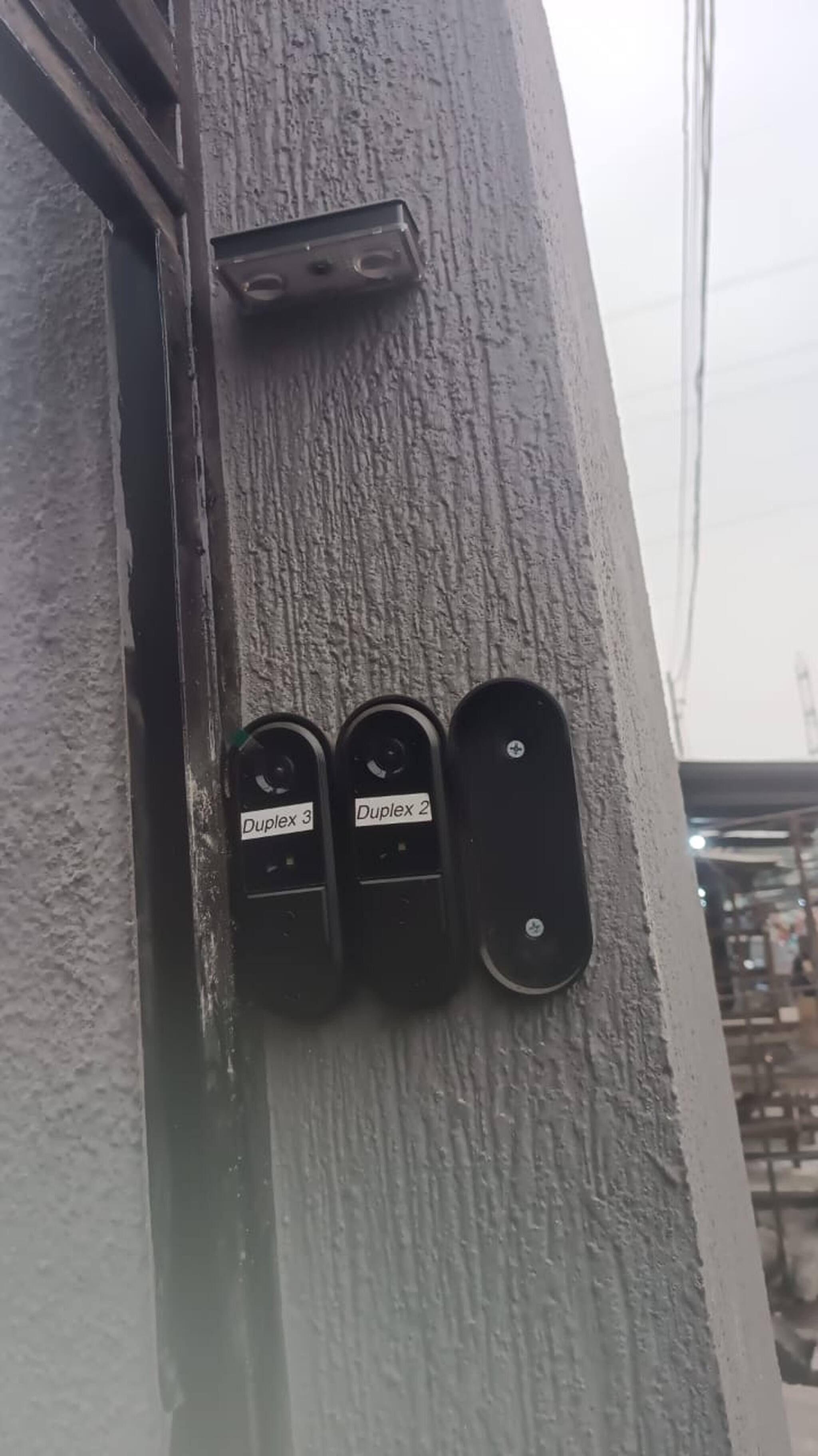 A wall-mounted device with three labels: Duplex 3, Duplex 2, and an unlabeled one.