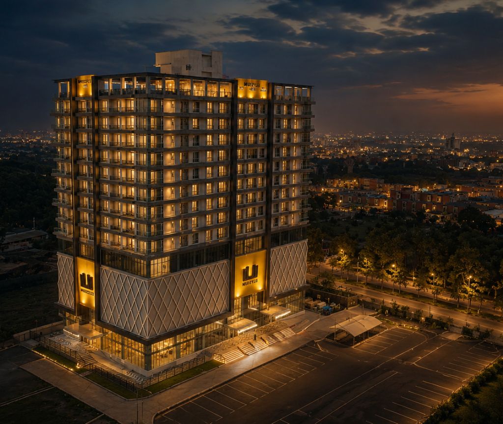 A multi-story hotel with a modern design, featuring a prominent entrance and a parking area.