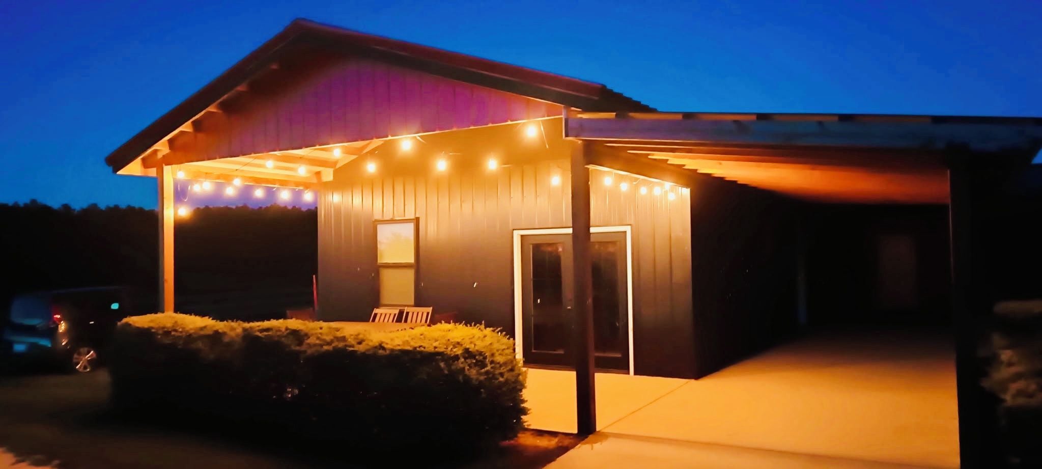 A house with a covered porch and a garage.