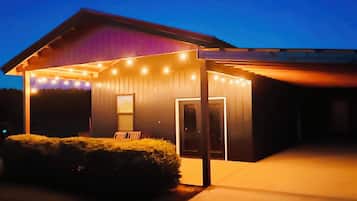 A house with a covered porch and a garage.