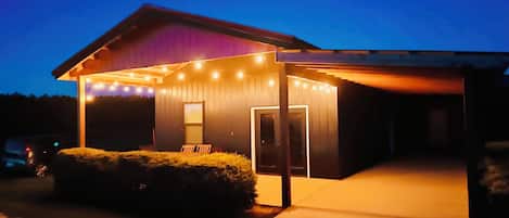 A house with a covered porch and a garage.