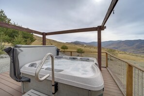 A hot tub on a wooden deck with a view of mountains. - 40-acre Methow Valley Home w/ Horse Boarding (Pateros)
