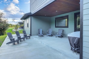 An outdoor patio with four Adirondack chairs and a covered table. - Mtn Views & On-site Creek! Red Lodge Gem (Red Lodge)
